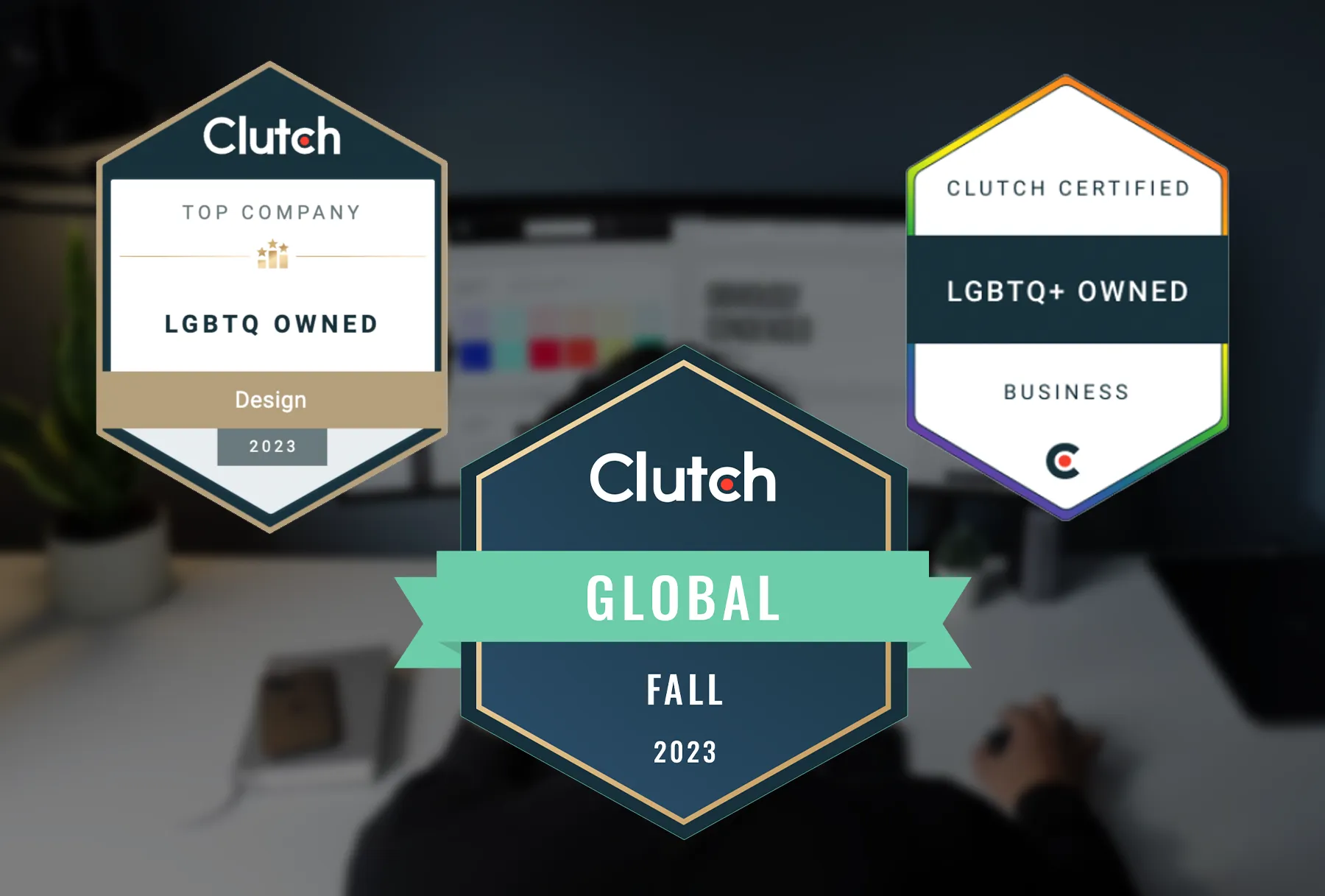 Certifications of the agency rating platform clutch.co are set on on top of a desk backdrop